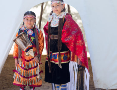 Diana Fields' children dressed in the traditional clothing of their cultural heritage