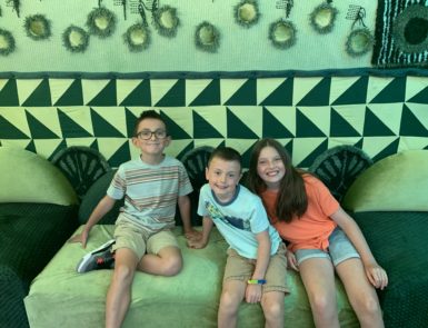 group of kids at the Synesthesia exhibit at Fred Jones Junior Museum of Art