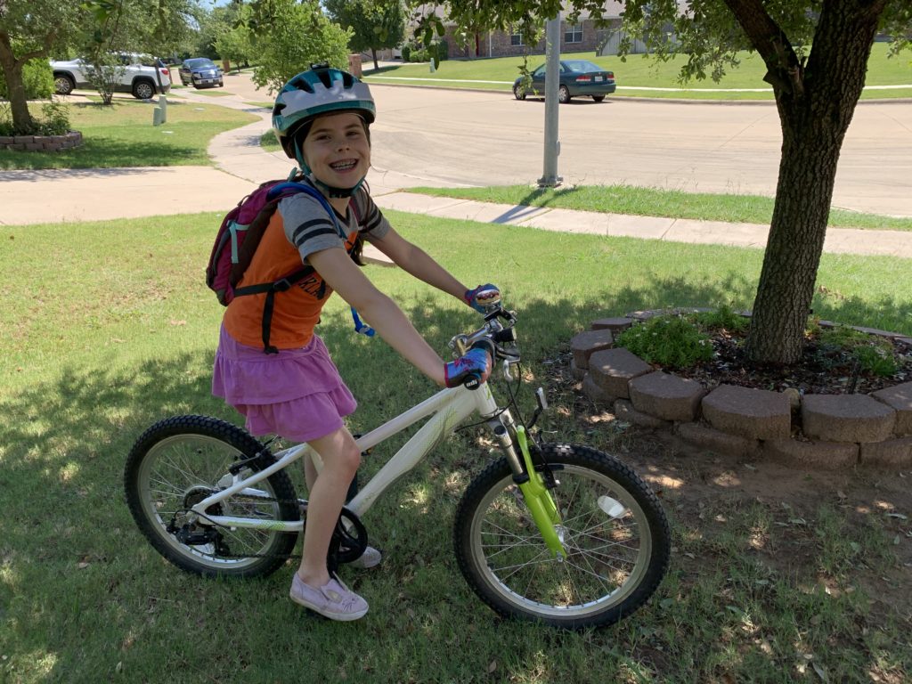 young girl prepares for a biking adventure, Olympic activities in OKC