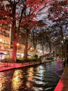 The River Walk draped in twinkling holiday lights.