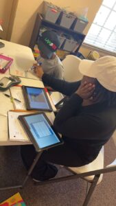 A student working with a tutor to practice good study habits